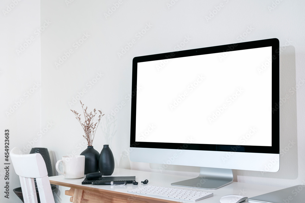 Mockup blank screen computer monitor with keyboard and mouse on wooden table, home office concept. Mockup blank screen computer monitor with keyboard and mouse on wooden table, home office concept.