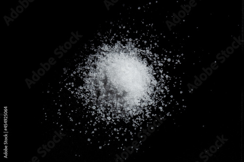 pile of sea salt on black background