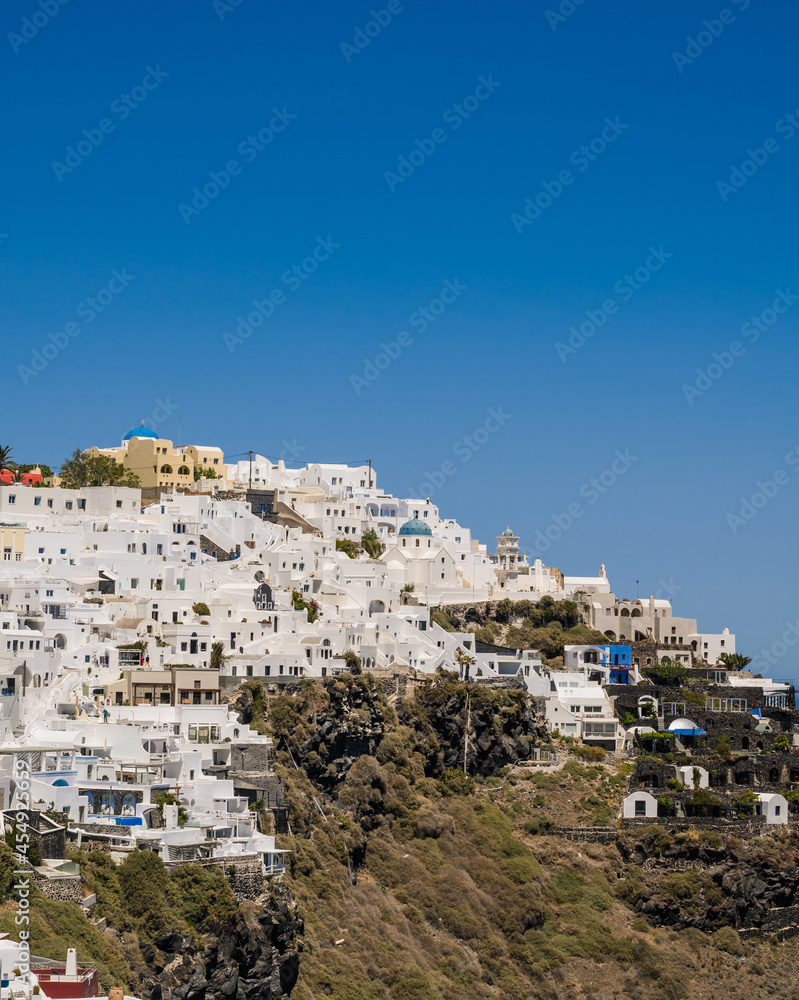 Beautiful Cycladic white architecture. Cityscape of village Imerovigli. Town on hill. Santorini.