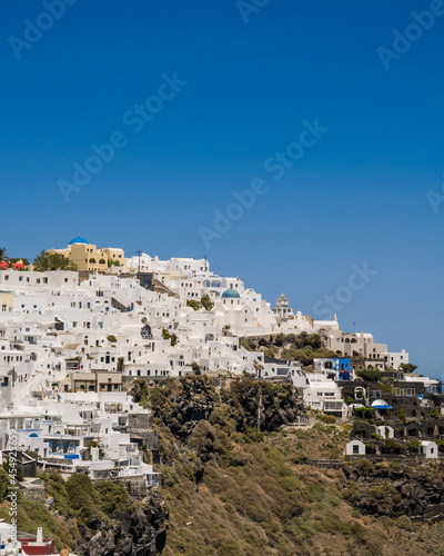 Beautiful Cycladic white architecture. Cityscape of village Imerovigli. Town on hill. Santorini. © Anastasia