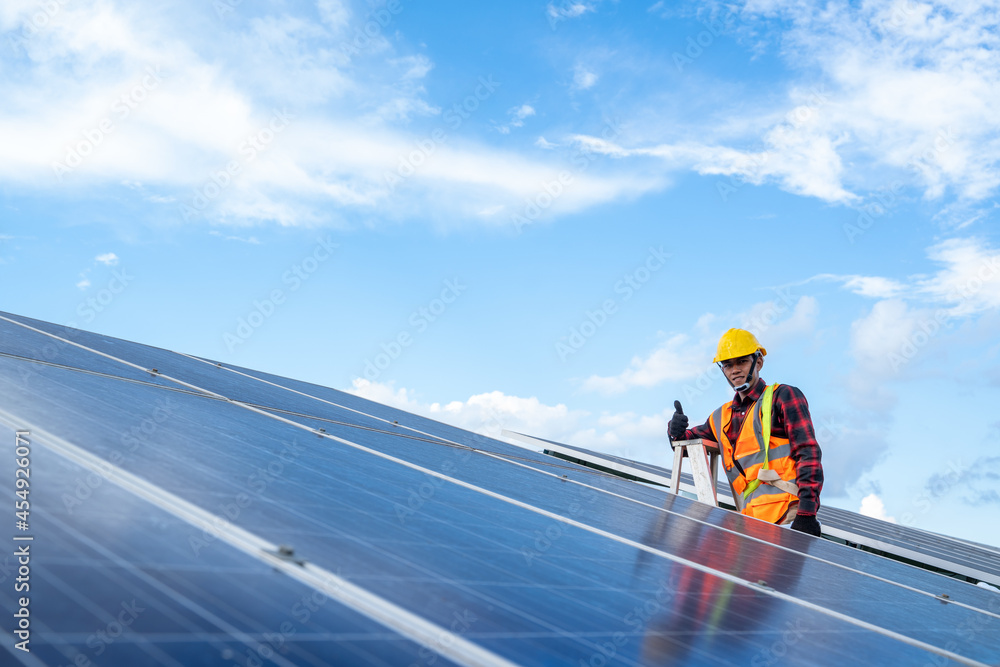 Engineer or electrician working on replacement solar panel at solar power plant,Concept solar power plant to innovation of green energy for life. Engineer or electrician working on replacement solar panel at solar power plant,Concept solar power plant to innovation of green energy for life.