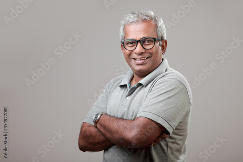 Mature man of Indian ethnicity with a smiling face expression