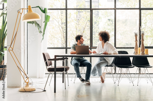 Canvastavla Young multiracial colleagues sharing ideas in bright co working loft office