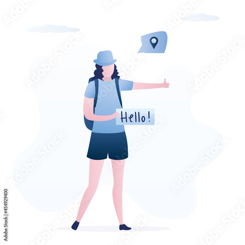 Cute woman hitchhiker on the road is holding blank board. Auto stop, concept. Time to travel the world, holidays, summer vacations. Female tourist with backpack.