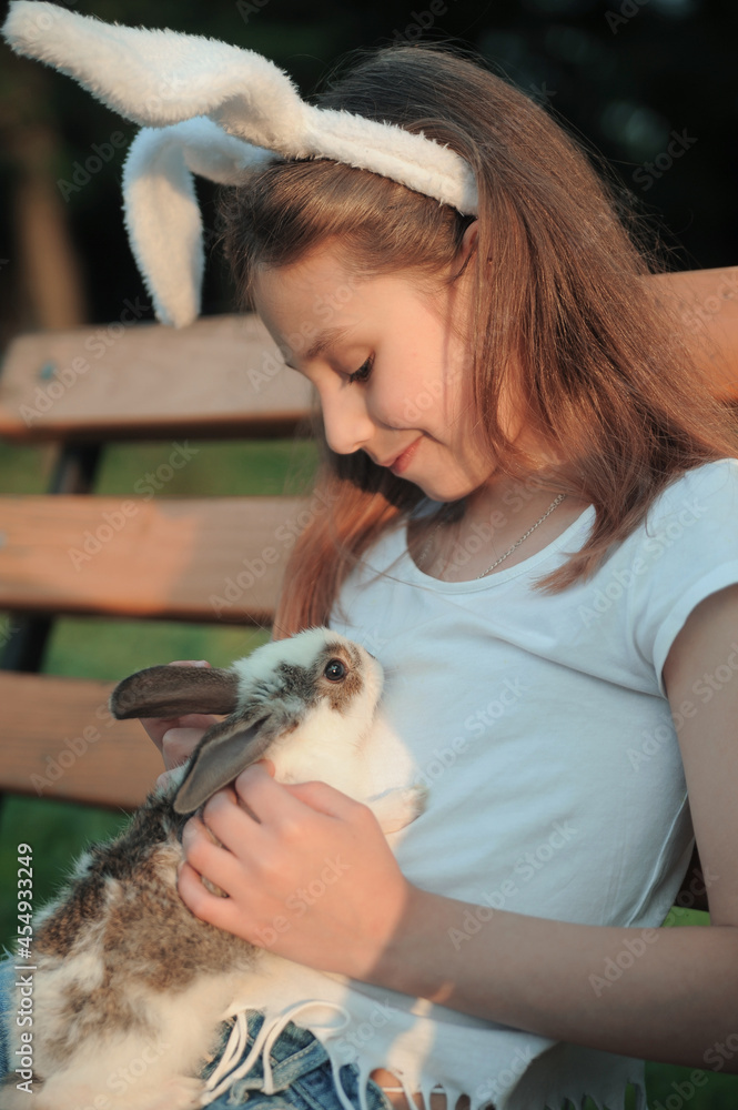Friendship between child and animal concept. Rabbit symbol of Easter. Friendship between child and animal concept. Rabbit symbol of Easter.
