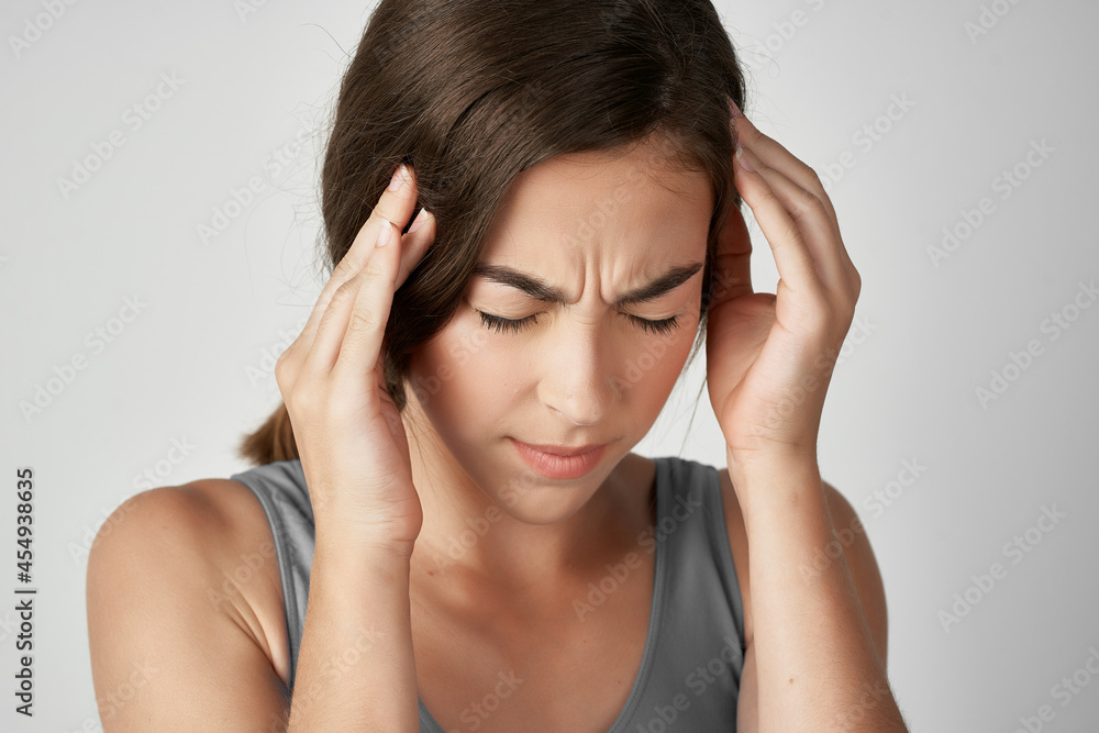 woman holding her head health problems discontent migraine woman holding her head health problems discontent migraine