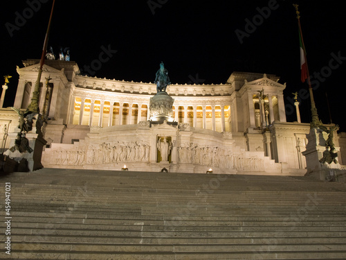 Piazza Venezia in the center of Rome at night.