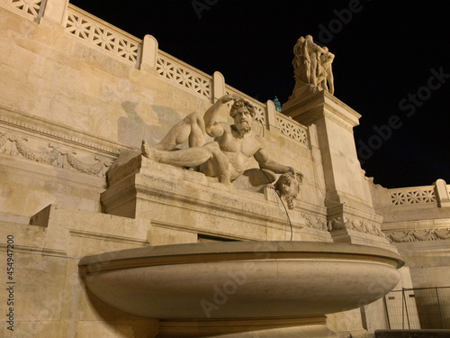 Piazza Venezia in the center of Rome at night.