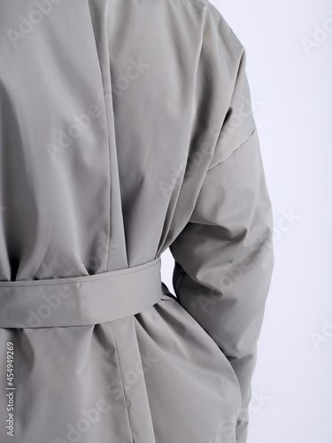Coat, raincoat, trench-autumn clothes on a white background 