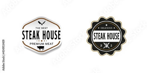 Vintage Retro Steak House Logo Design. With crossed cleavers or knives, cow, and beef or meat icons. Premium and luxury label or sticker