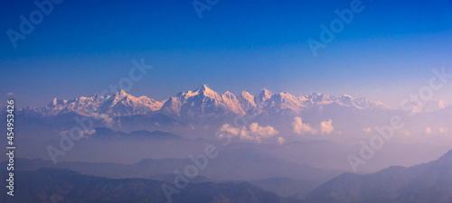 View of Himalays during sunrise at Binsar, a hill station in Almora district, Uttarakhand, India. photo