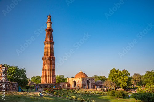 Qutub Minar is a highest minaret in India standing 73 m tall tapering tower of five storeys made of red sandstone and marble established in 1192. It is UNESCO world heritage site at  New Delhi,India photo