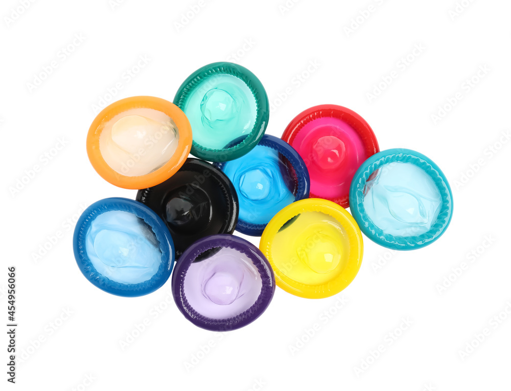 Unpacked colorful condoms on white background, top view. Safe sex Unpacked colorful condoms on white background, top view. Safe sex