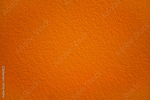 Orange concrete wall texture with empty copy space