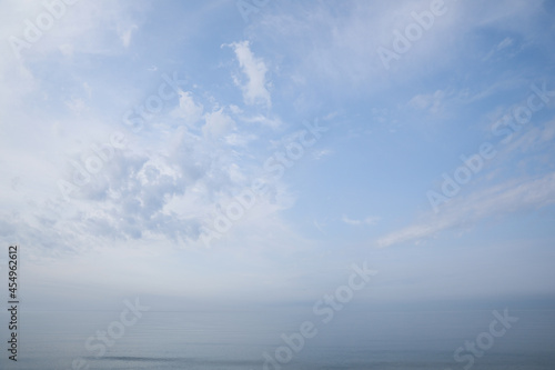 Picturesque view of beautiful blue sky with white clouds over sea