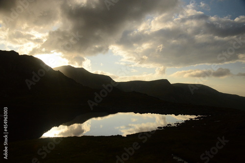 a view looking over to the mountains around tryfan looking over the lake Llyn Bochlwyd  photo