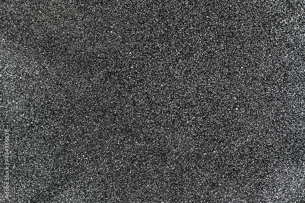 Fototapeta premium Gray surface with fine texture and white dots. Abstract neutral background for design. Backdrop