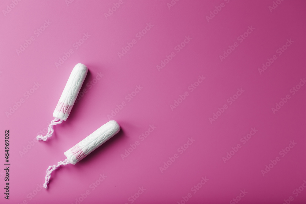 Gynecological tampons on a pink background free space Gynecological tampons on a pink background free space