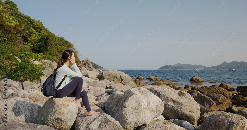 Woman sit on the rock at countryside