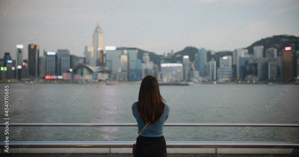 Woman look at Hong Kong city