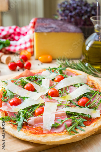 pizza focaccia with tomatoes, cheese and rucola