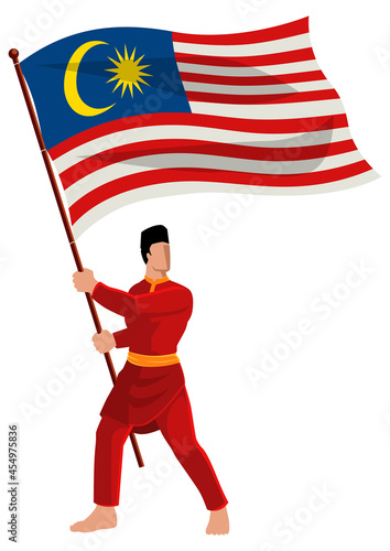 Man in malay traditional costume holding the flag of Malaysia