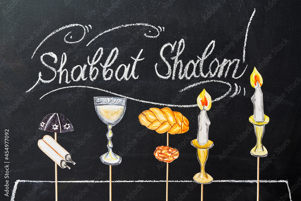 Shabbat Shalom - Jewish and Hebrew greetings. Candles painted on a chalkboard. May you dwell in completeness on this seventh day.