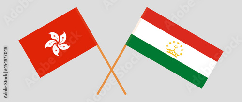 Crossed flags of Hong Kong and Tajikistan. Official colors. Correct proportion