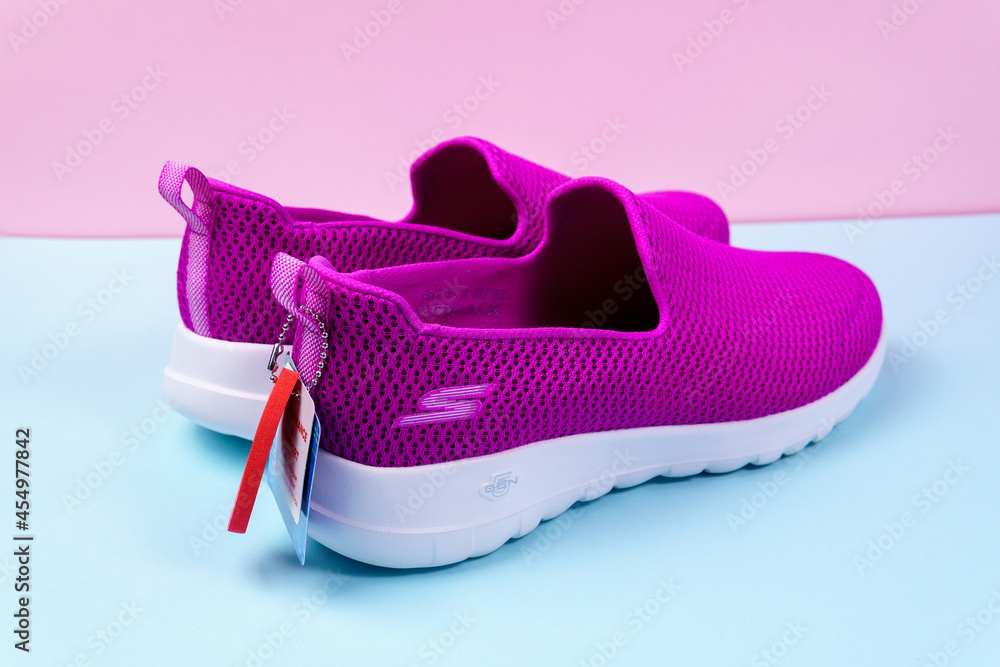 Tyumen, Russia-August 2021: Slip-on shoes for women Skechers Walk purple. Skechers USA, Inc. is an American lifestyle Stock | Adobe Stock