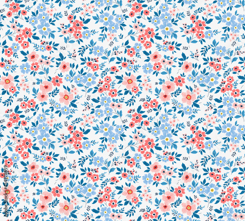 Cute floral pattern in the small flowers. Seamless vector texture. Elegant template for fashion prints. Printing with small pink and light blue flowers. White background.