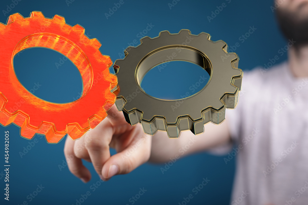Man draws gears on virtual screen. Blurred Abstract engine room.. Man draws gears on virtual screen. Blurred Abstract engine room..