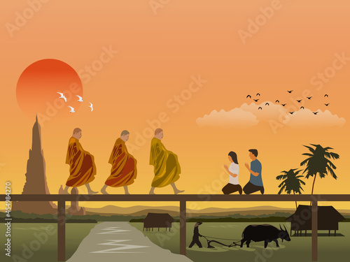 A Buddhist monk is walking on a wooden bridge with men and women sitting in worship. Farmers plowing fields with buffaloes with pagodas and the morning sky in the background.