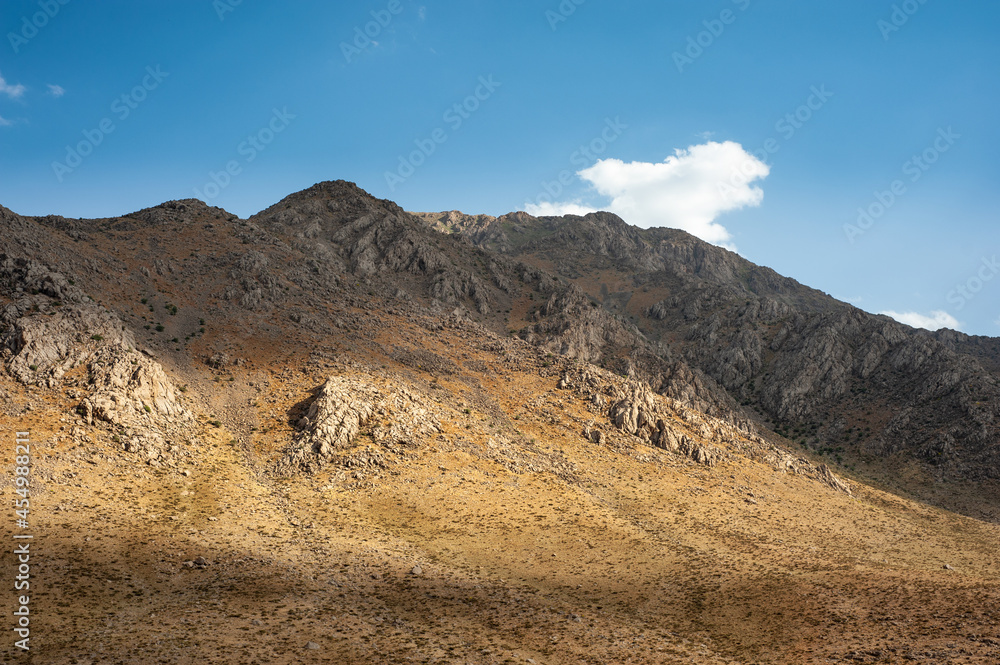 the shadow of clouds on a Rocky Mountain with autumnal foliage, Rocky Mountain khuzestan province, Iran the shadow of clouds on a Rocky Mountain with autumnal foliage, Rocky Mountain khuzestan province, Iran