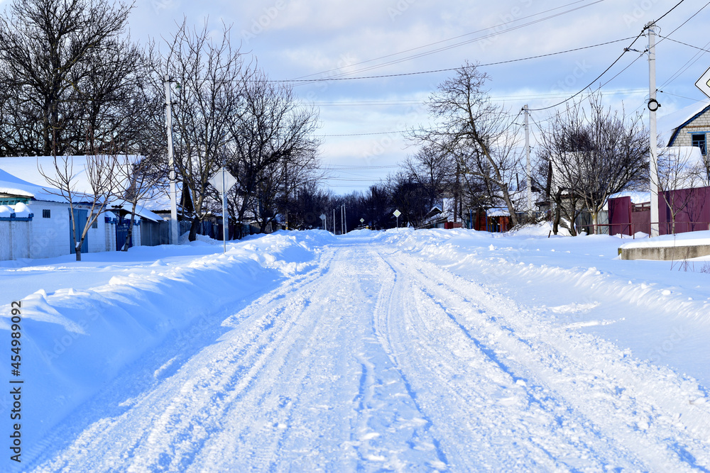 One of the many streets of the village when the snow stopped falling and the sun appeared in the sky. One of the many streets of the village when the snow stopped falling and the sun appeared in the sky.
