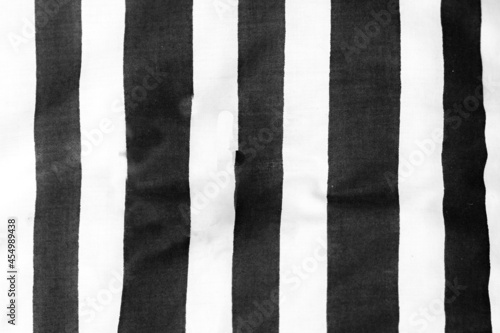 Black and white striped cloth laid out roughly to provide vertical blank lines.