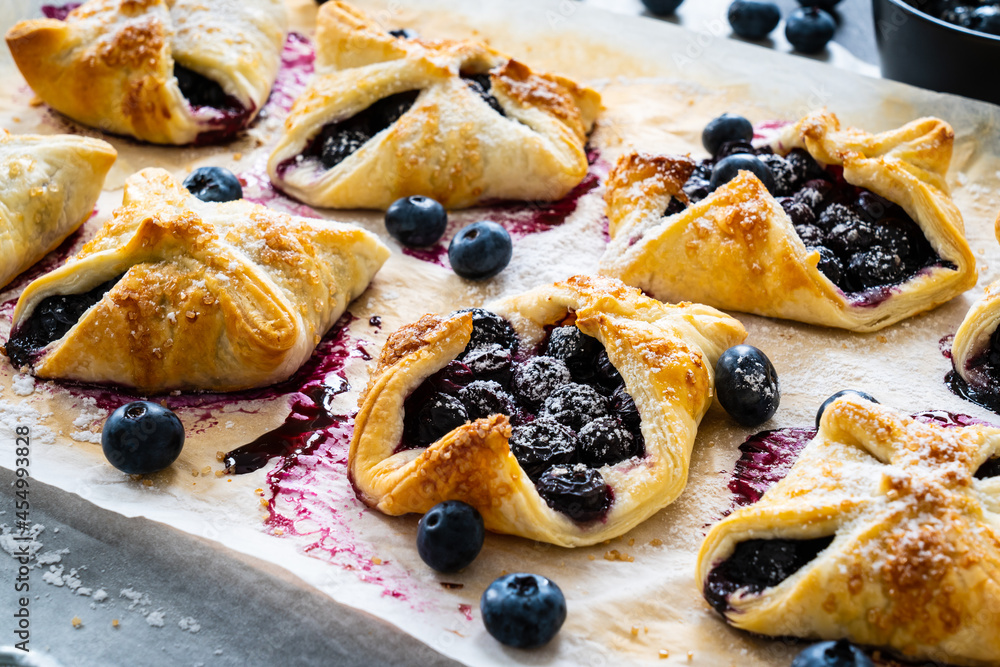 Blueberry cakes on baking paper Blueberry cakes on baking paper