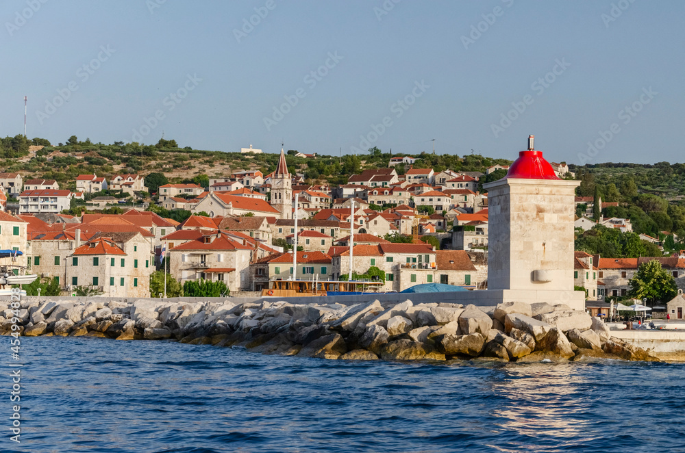 Obraz premium Picturesque bay and the old town of Postira. Postira lies on the northern coast of Brac island in Croatia.