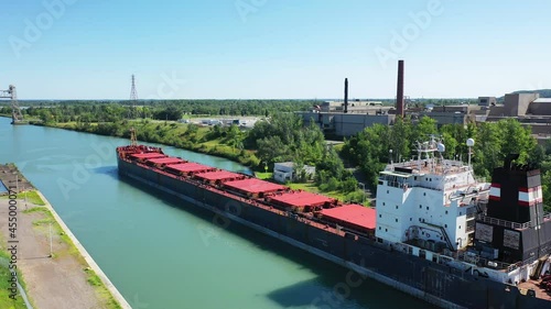 Aerial of a Lake Freighter leaving a lock in the Welland Canal, Canada 4K