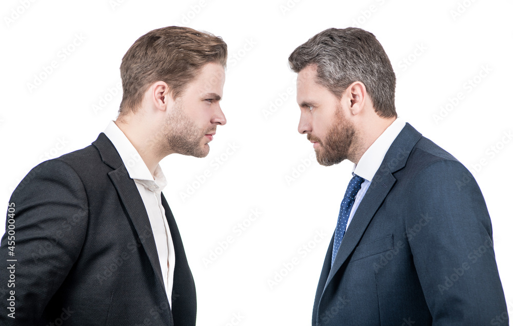 two businessmen starring to each other in business conflict, opposition two businessmen starring to each other in business conflict, opposition