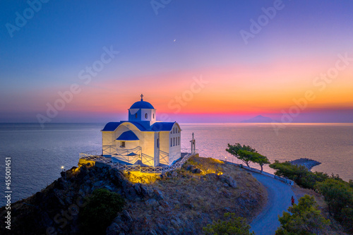 The small church of Agios Nikolaos at the entrance of the port on the island of Lemnos in Greece photo