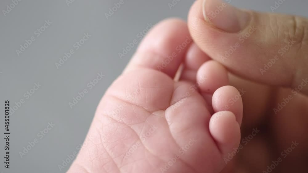 Macro shot of infants toe. Mother touching her small child's toes while he is asleep. Slow motion Video of mother touching her son’s feet. Macro shot of infants toe. Mother touching her small child's toes while he is asleep. Slow motion Video of mother touching her son’s feet.