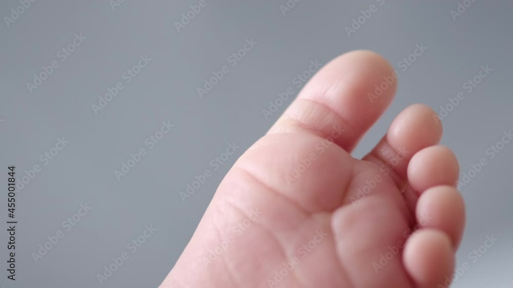 Macro shot of child toes. Close up on infants foot. Cute video of a small kids fingers and small adorable nails. Macro shot of child toes. Close up on infants foot. Cute video of a small kids fingers and small adorable nails.