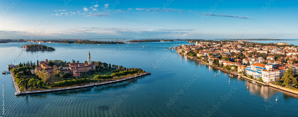 Fototapeta premium Flying over small Venice islands located in the middle of the Venetian lagoon. Beautiful aerial view of Venice.