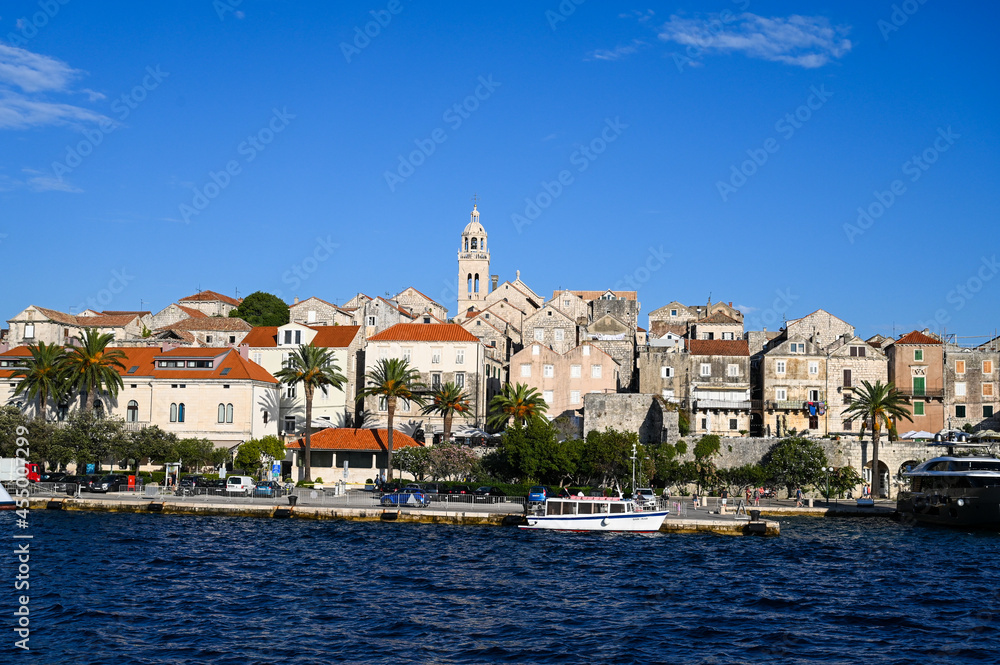Historic town of Korcula, Croatia. Stone walls, towers, houses and buildings in old town. Adriatic sea and island of Korcula. 