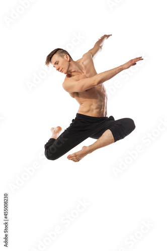 modern ballet dancer posing over white background