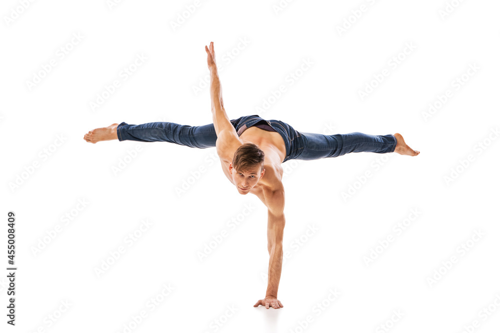 Fototapeta premium modern ballet dancer posing over white background