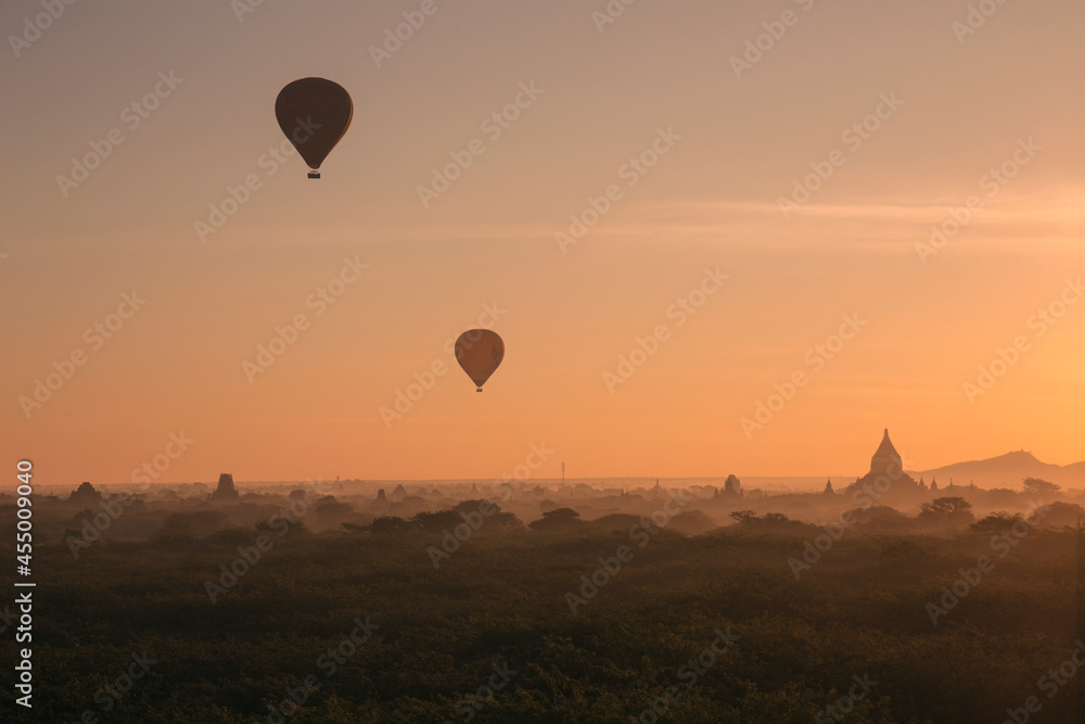 hot air balloon rise up over the ancient temples in Bagan Myanmar at sunrise hot air balloon rise up over the ancient temples in Bagan Myanmar at sunrise