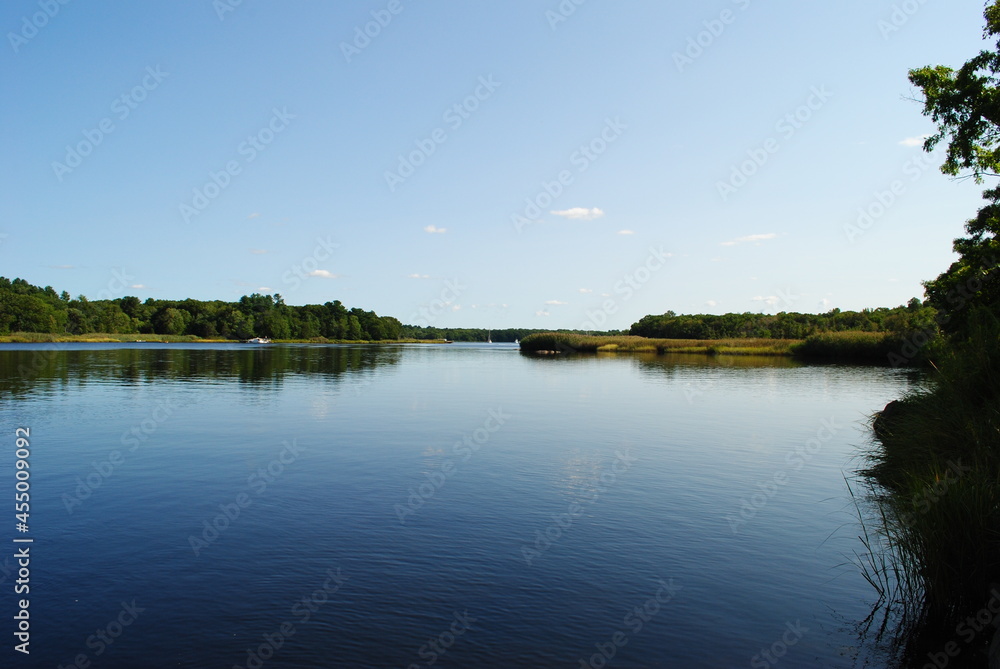 Calm river landscape with a clear blue sky Calm river landscape with a clear blue sky