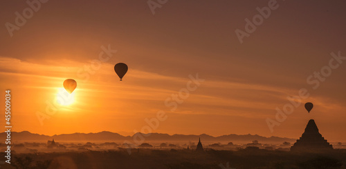 hot air balloon rise up over the ancient temples in Bagan Myanmar at sunrise
