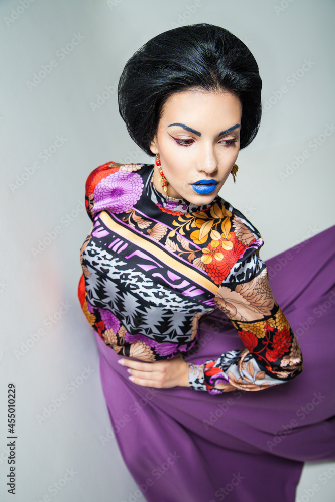 Fashion photo of young woman in purple dress Fashion photo of young woman in purple dress